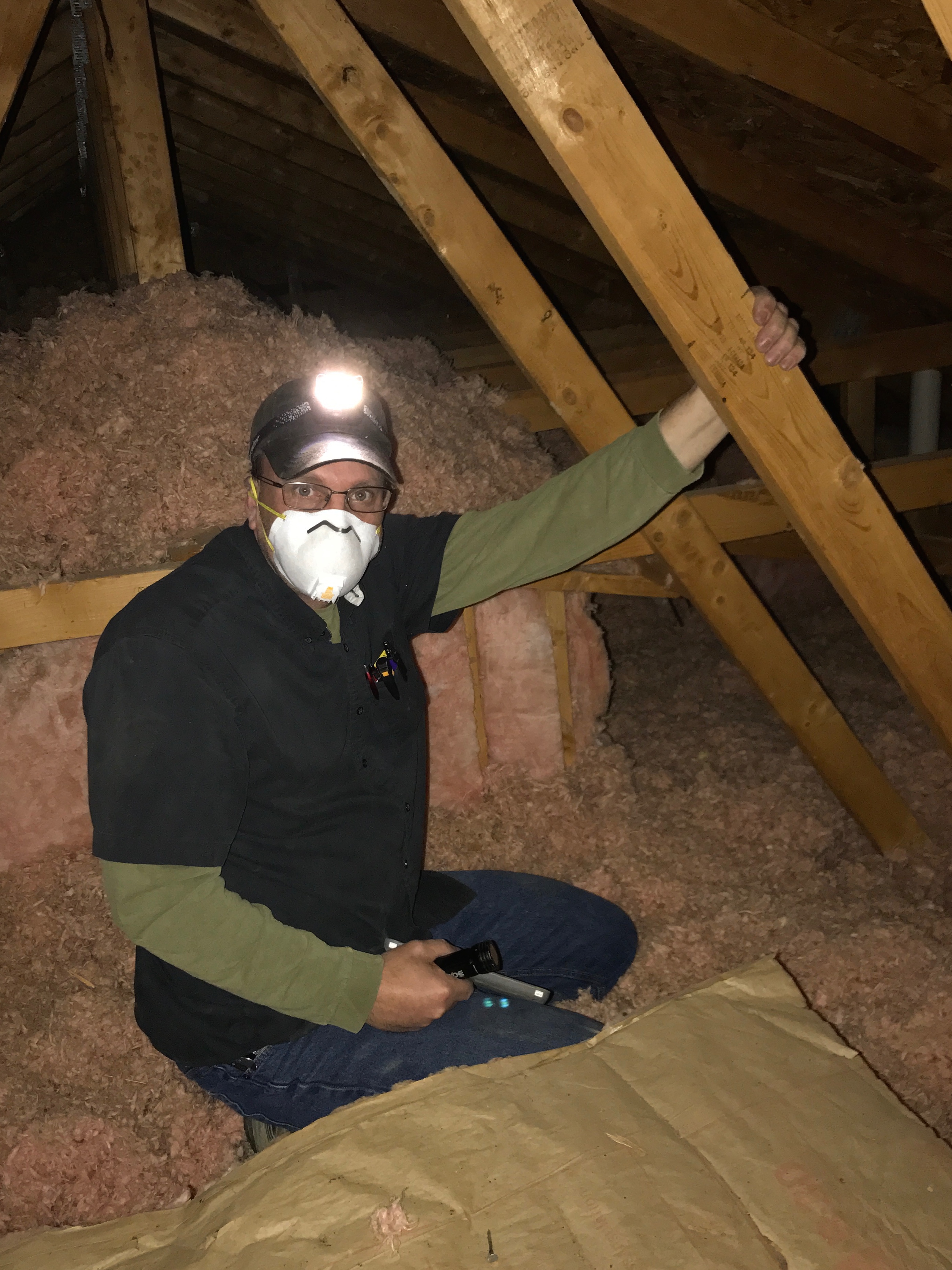 John Lawson of Assured Home Inspections inspecting the attic of a single-family home in Northern Kentucky